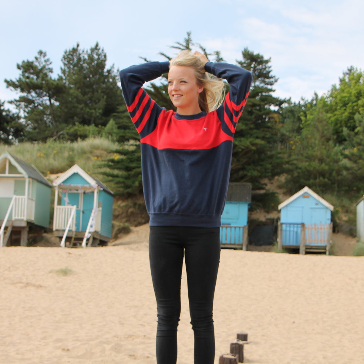 Female model at popular Norfolk beach wearing an original Whale Of A Time Clothing design.